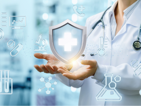Hands of a doctor holding the healthcare shield symbol