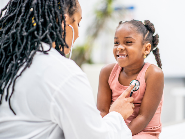 Doctor checks heart of young girl
