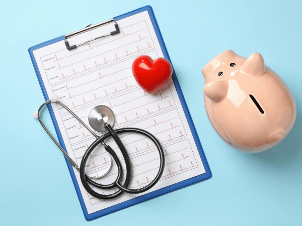 Medical chart clipboard with stethoscope and piggy bank